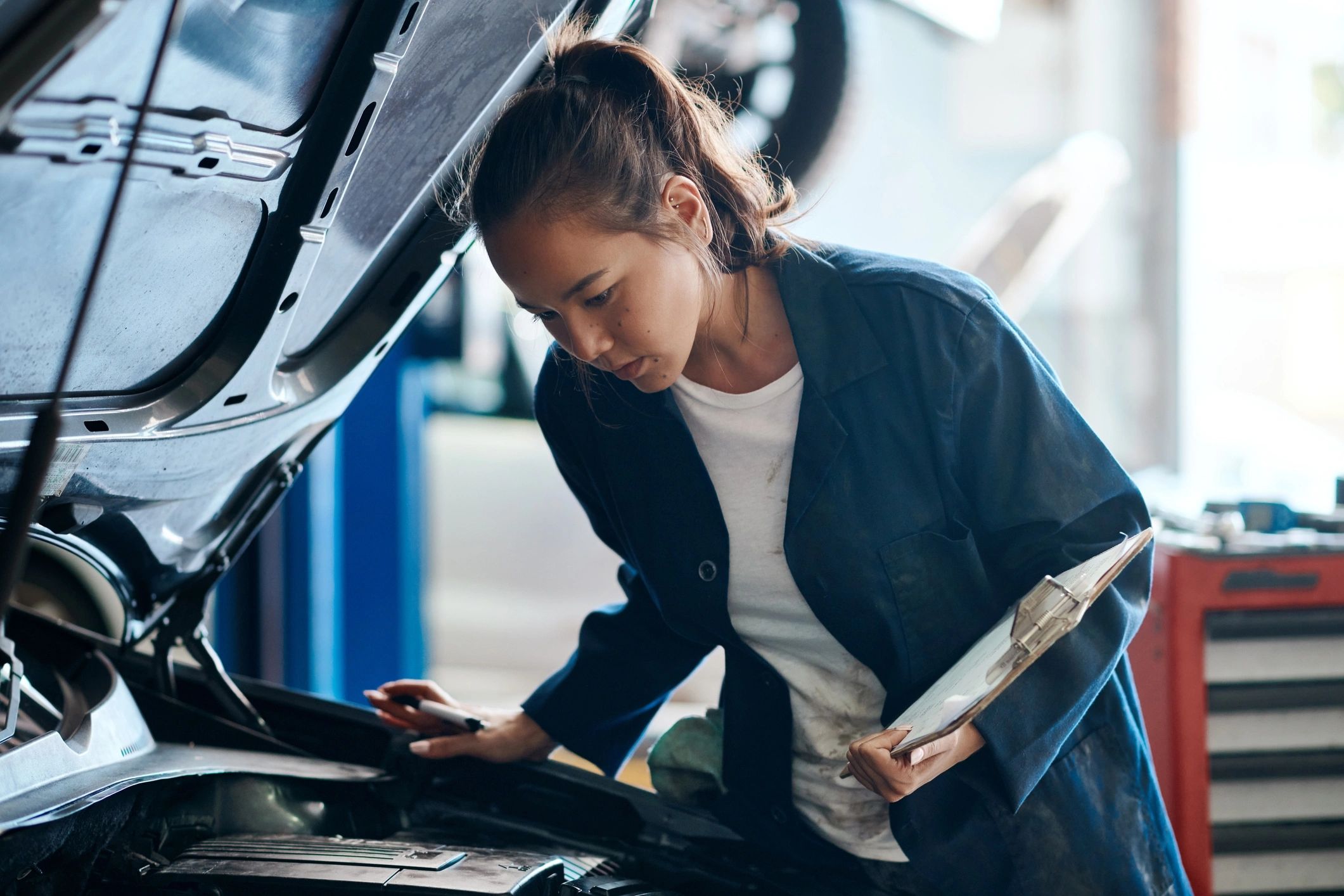 Mechanic performing careful automotive repair work