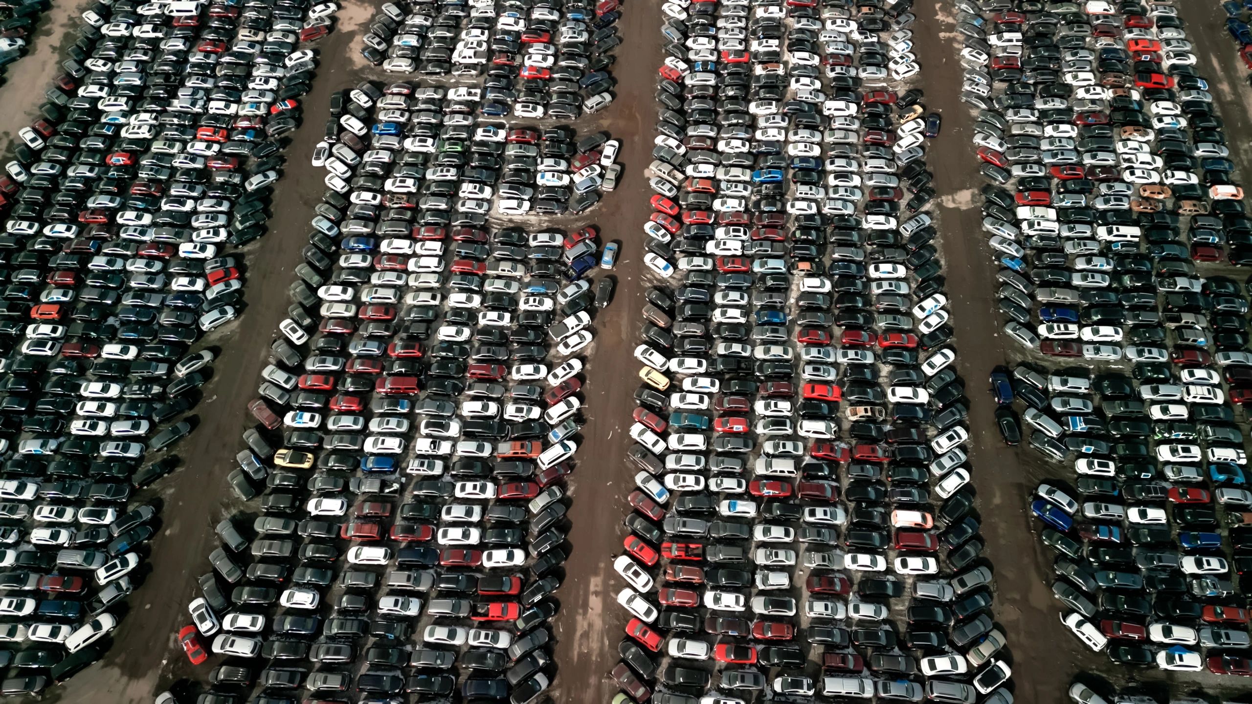Aerial view of used cars in a dealership lot